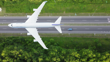 plane flies above the landscape. Side view of aircraft. Travel and transportation concept.