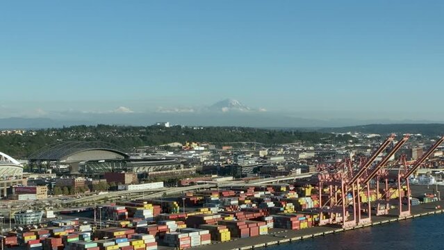 Aerial view of the Seattle shipyard with Mount Rainier looming in the backdrop.