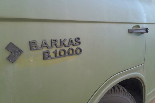 Close up logo at the car of a vintage minivan Barkas B1000 from the Ex GDR (East Germany) in Berlin, December 30 2022
