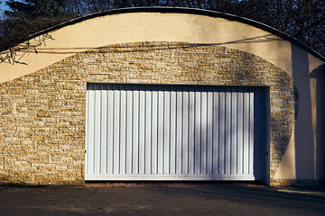 White automatic garage doors opening horizontally