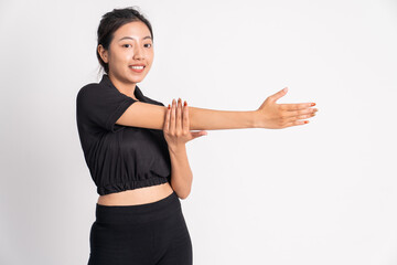 asian woman in black tracksuit stretching hands on background isolated