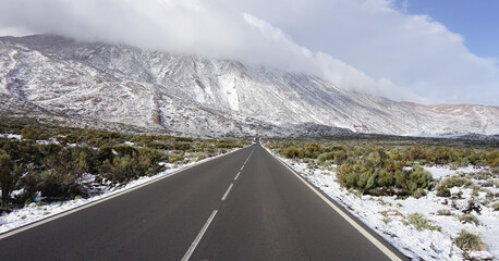 Teide National Park with snow on December, 27, 2022, the road through the park 