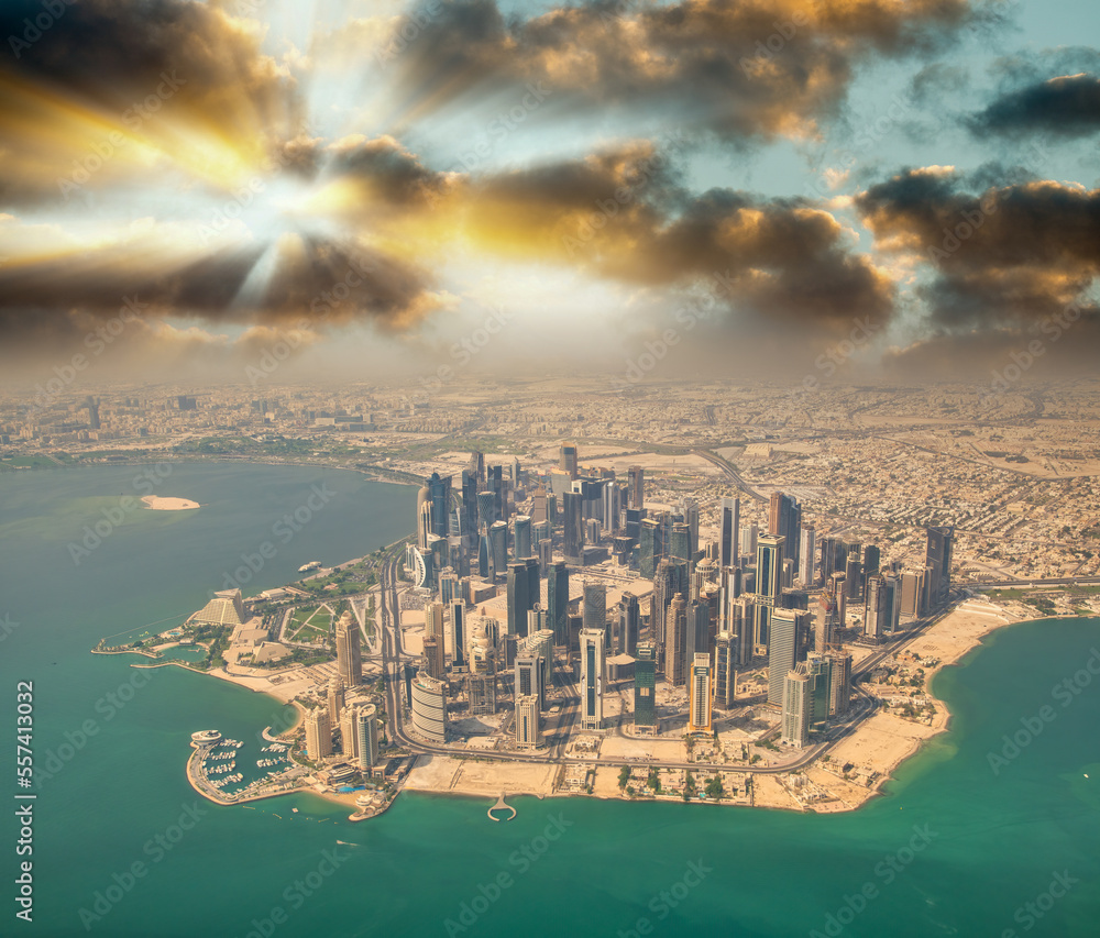 Sticker aerial view of doha skyline from airplane. modern skyscrapers at sunset, qatar