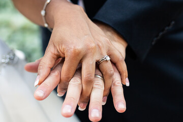 Interracial bride and groom holding hands