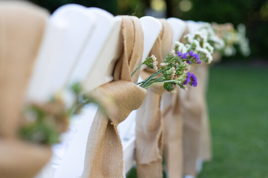 Seat-Back Floral Arrangement at Outdoor Wedding
