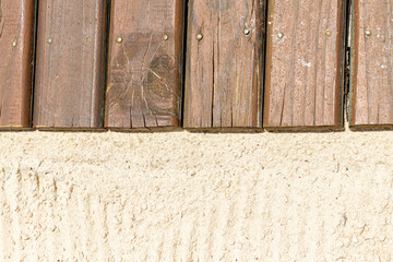 Closeup of wooden sidewalk over sand floor. Top view