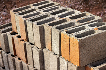 Several building blocks (bricks) stacked under sunlight