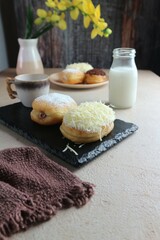 Cream filled buns topped with sugar and cheese