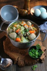 meatball soup with chunks of meat and vegetables