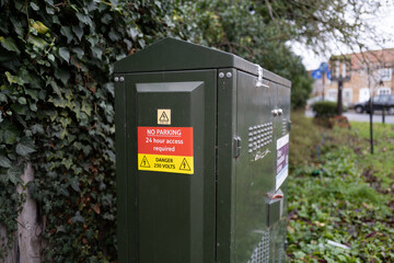 Shallow focus of an Internet Broadband telecoms cabinet in a rural location. Showing warning...