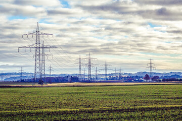 Rural landscape view with electrical power poles trail