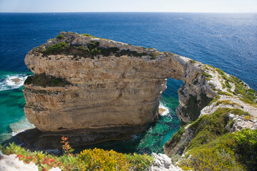 Landward view from above of the famous Tripitos Arch, Paxos, Ionian Islands, Greece.  It is over 20...