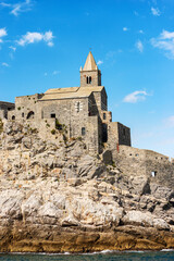 Headland in Portovenere or Porto Venere with the medieval church of San Pietro (St. Peter, 1198), UNESCO world heritage site. La Spezia, Liguria, Italy, Europe.