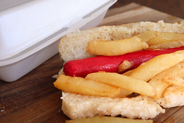 Vienna and chips hot dog. Traditional South African fast foods, Vienna and chips parcel