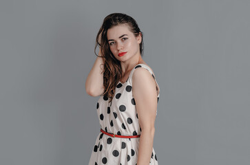 Sexy girl looks sideways at the camera