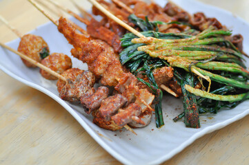 barbecued pork or grilled pork , grilled chitterlings or fried chitterlings