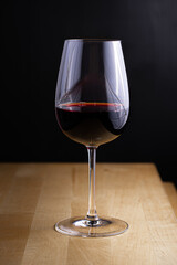 Glass of red wine on dark backgroud