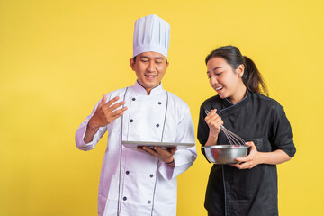 imaginary male chef carrying delicious bread on tray with female chef using whisk with mixing bowl...