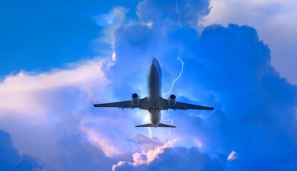 Airplane in the sky with thunder and lightning