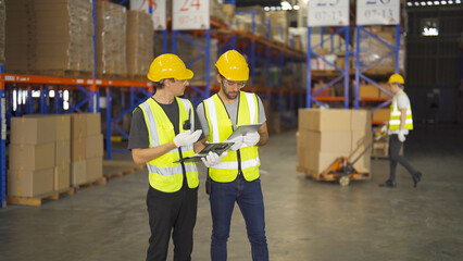 Teamwork of workers working in large warehouse retail store industry.Rack of stock storage. Interior of cargo in ecommerce and logistic concept. Depot. People lifestyle. Shipment service for container