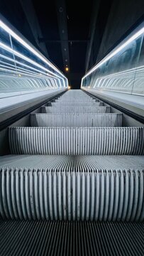Modern moving escalator in Kopenhagen metro station totaly empty during covid lockdown 2020