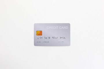 Closeup of silver credit card mockup with security chip embedded isolated in white background.