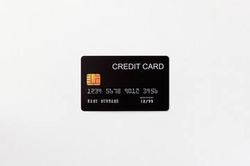 Closeup of black credit card mockup with security chip embedded isolated in white background.