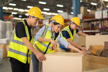 Teamwork of Asian workers working in large warehouse store industry.Rack of stock storage. Interior of cargo in ecommerce and logistic concept. Depot. People lifestyle. Shipment service for container