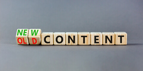 New or old content symbol. Concept words New content and Old content on wooden cubes. Beautiful grey table grey background. Business New or old content concept. Copy space.