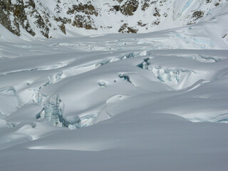 Crevasses in ice and snow on a glacier in the Alaska Range mountains