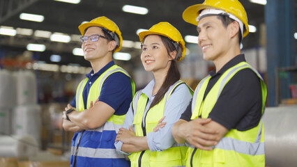 Teamwork of Asian workers working in large warehouse store industry.Rack of stock storage. Interior of cargo in ecommerce and logistic concept. Depot. People lifestyle. Shipment service for container