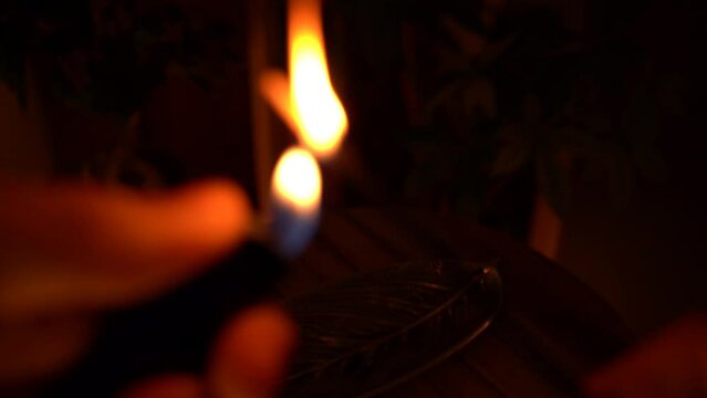 lighting an joss stick in a warm light relaxing room