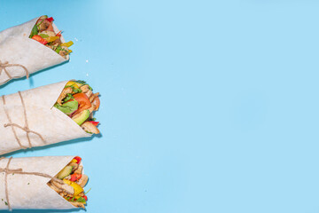 Fototapeta na wymiar Wrapped sandwich burrito or shawarma