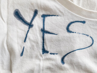 Writing Yes on T-Shirt with Ink