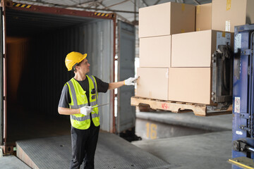 Portrait of caucasian worker working in large warehouse store industry.Rack of stock storage. Interior of cargo in logistic concept. Depot. People lifestyle. Shipment service for container