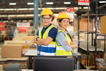 Teamwork group of Asian man worker working in large warehouse retail store industry factory. Rack of stock storage. Cargo in ecommerce and logistic concept. Depot. People lifestyle. Shipment service.