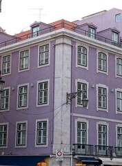 Fototapeta na wymiar Colorful purple stone building in Lisbon, Portugal