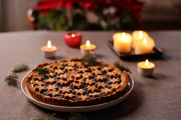 selective focus on christams tart near a group of candles