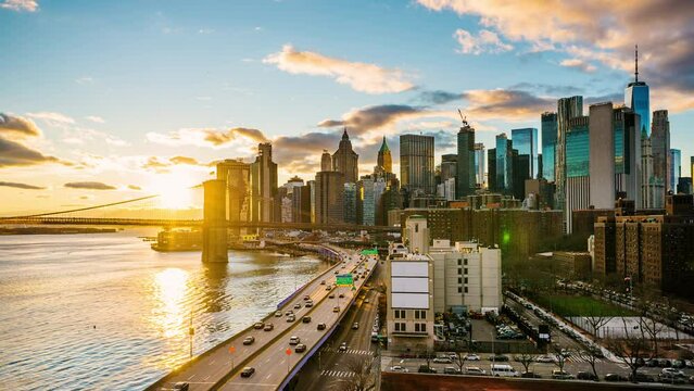 Panoramic view of Brooklyn bridge and Manhattan. Timelapse at sunset, New York City.