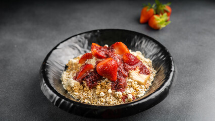 whole grain oatmeal with rapid protein resource and our strawberry special sauce served in dish isolated on table top view of arabic food