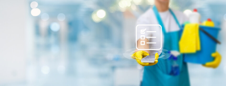 Cleaner showing checklist app on phone .