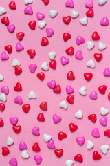 Candy hearts on pink background. Valentine's day. Holiday background