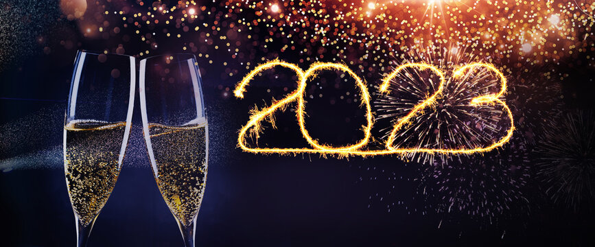 new year background with champagne glasses and fireworks