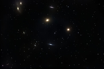 A pile of galaxies in the night sky.