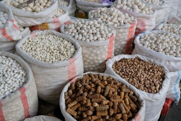 Big bags with kurut - dried cottage cheese in Osh Bazaar, central market in Bishkek, Kyrgyzstan.  