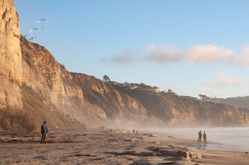 people on a foggy beach