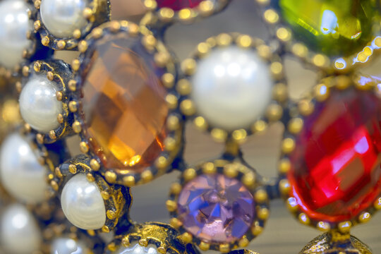 Macro image of jewels on a brass bracelet