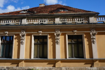 Fragment of old tenement house with decorative pilasters and balustrade. Tarnowskie Gory, Poland.