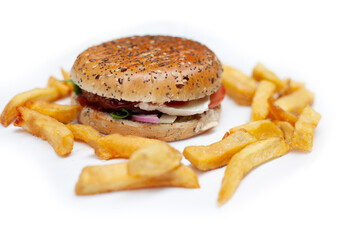 Tasty, fresh hamburger with french fries on a white table unhealthy food