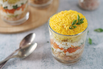 Mimosa salad in transparent glass